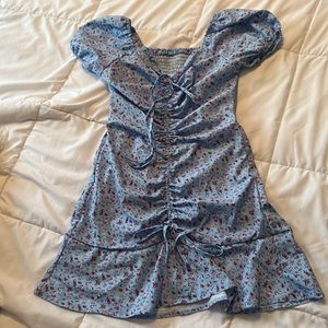Baby blue floral fitted dress with adjustable cinching from the top and bottom.